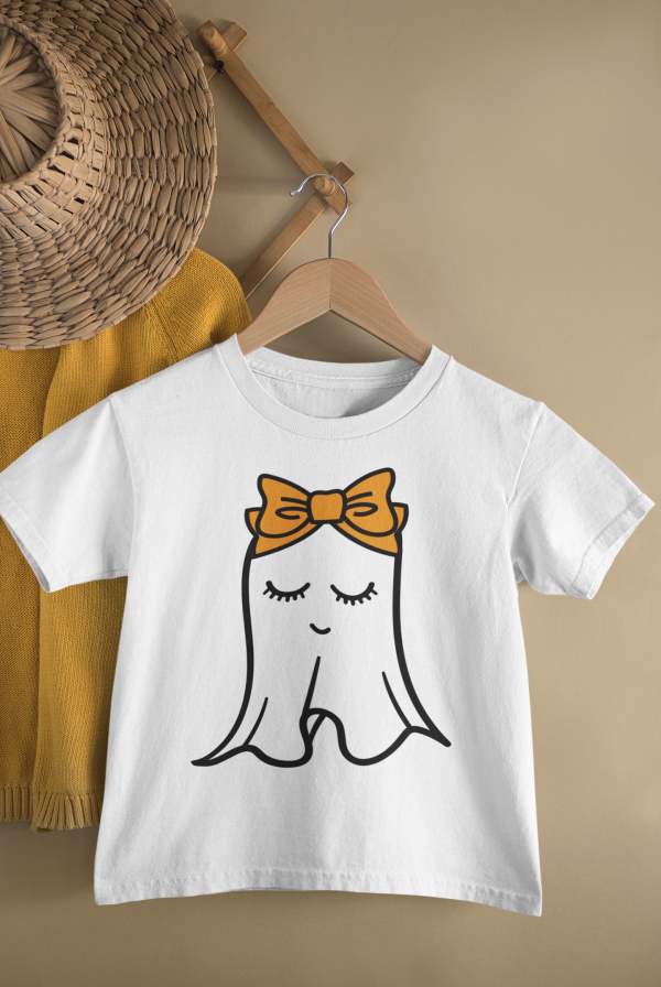 mockup of a kid s t shirt hanging from a wall rack 33736 7